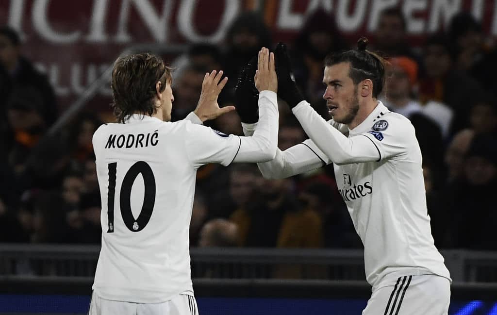 Real Madrid's Welsh forward Gareth Bale (R) celebrates with Real Madrid's Croatian midfielder Luka Modric after opening the scoring during the UEFA Champions League group G football match AS Rome vs Real Madrid on November 27, 2018 at the Olympic stadium in Rome. (Photo by Filippo MONTEFORTE / AFP) (Photo credit should read FILIPPO MONTEFORTE/AFP/Getty Images)