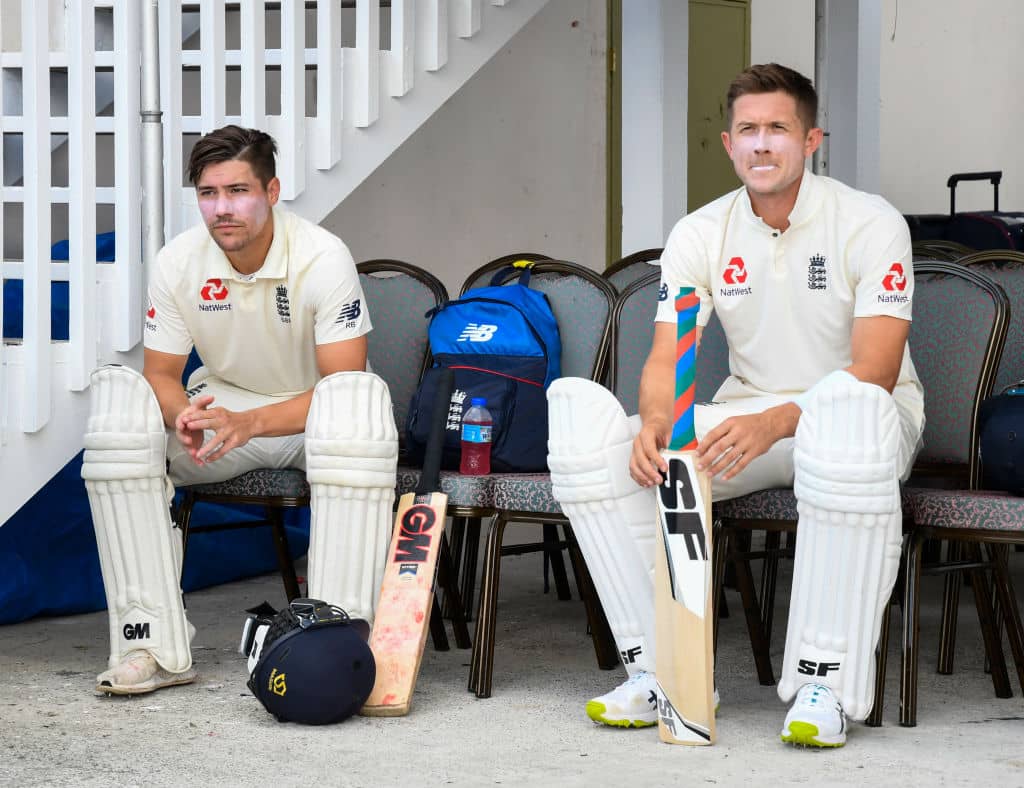 Rory Burns (L) and Joe Denly (R) of England during day 1 of the 2nd Test between West Indies and England at Vivian Richards Cricket Stadium in North Sound, Antigua and Barbuda, on January 31, 2019. (Photo by Randy Brooks / AFP) (Photo credit should read RANDY BROOKS/AFP/Getty Images)