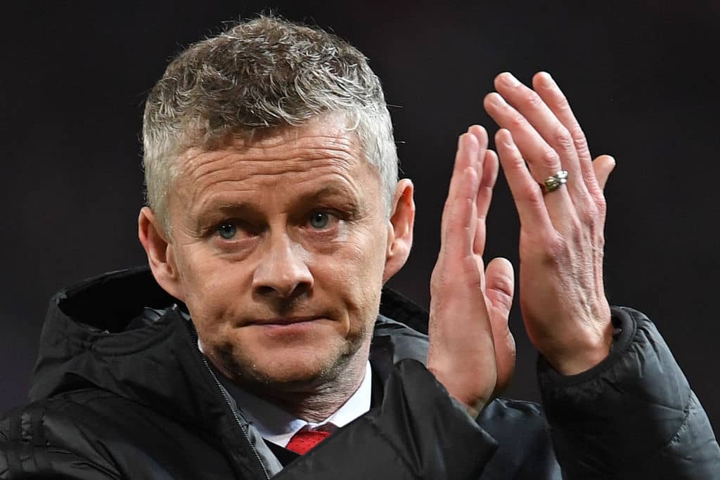 Manchester United's Norwegian caretaker manager Ole Gunnar Solskjaer applauds the fans following the first leg of the UEFA Champions League round of 16 football match between Manchester United and Paris Saint-Germain (PSG) at Old Trafford in Manchester, north-west England on February 12, 2019. - PSG won the match 2-0. (Photo by Paul ELLIS / AFP) (Photo credit should read PAUL ELLIS/AFP/Getty Images)