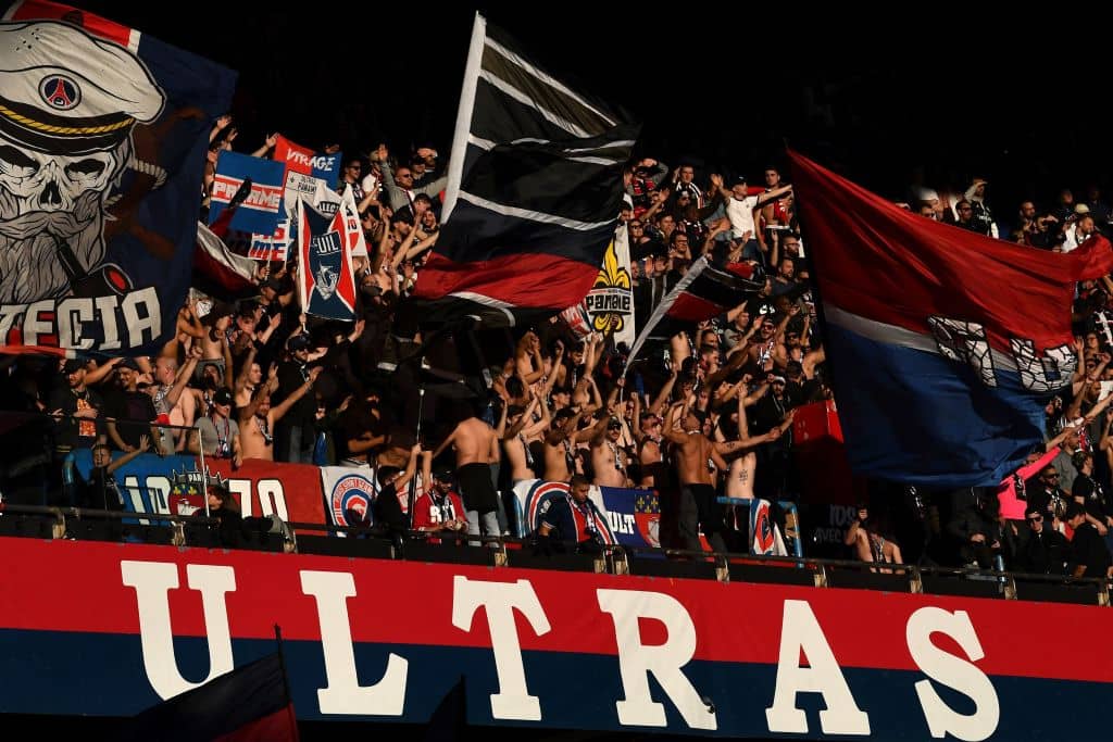 Paris Saint-Germain's supporters cheer behind a banner reading "Ultras Paris" during the French L1 football match between Paris Saint-Germain and Nimes at the Parc de Princes in Paris on 23 February 2019. (Photo by FRANCK FIFE / AFP) (Photo credit should read FRANCK FIFE/AFP/Getty Images)