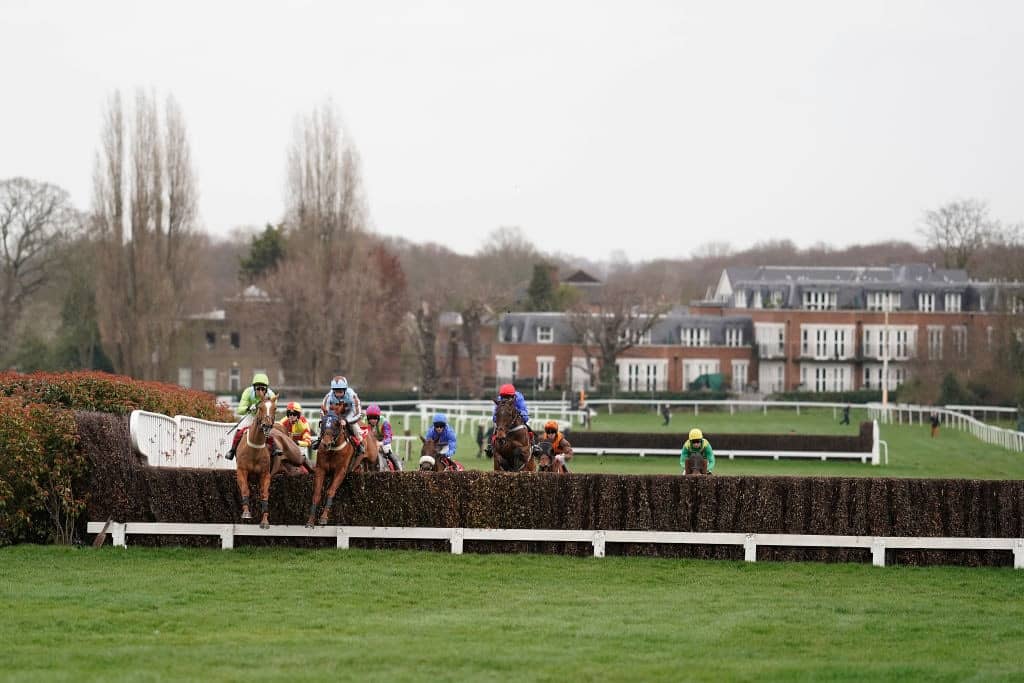 ESHER, ENGLAND - MARCH 08: A general view as runners clear a fence at Sandown Park Racecourse on March 08, 2019 in Esher, United Kingdom. (Photo by Alan Crowhurst/Getty Images)