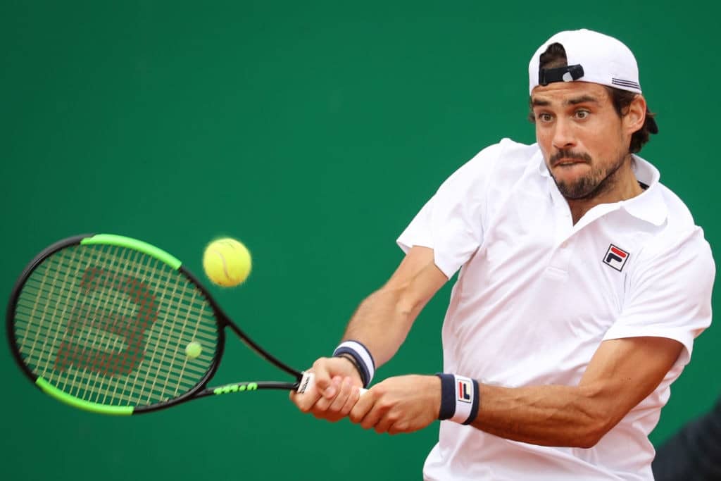 Argentina's Guido Pella plays a backhand return to Croatia's Marin Cilic during their tennis match on the day 4 of the Monte-Carlo ATP Masters Series tournament on April 16, 2019 in Monaco. (Photo by Valery HACHE / AFP) (Photo credit should read VALERY HACHE/AFP/Getty Images)