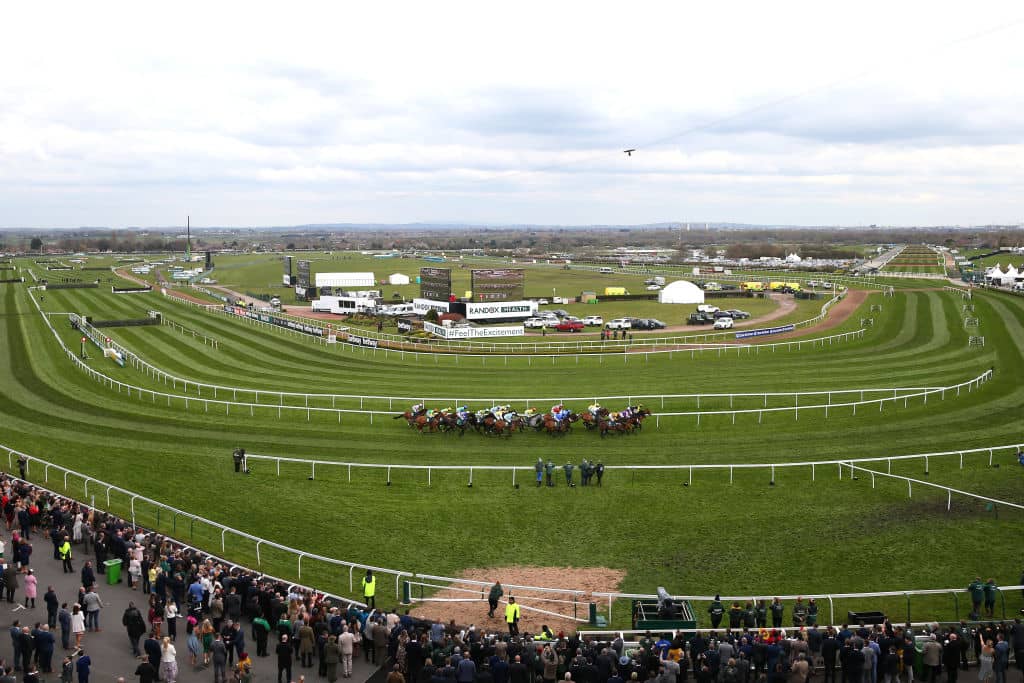 LIVERPOOL, ENGLAND - APRIL 05: A general view as the runners and riders go past the main stand in the Merseyrail Handicap Hurdle during Ladies Day at Aintree Racecourse on April 05, 2019 in Liverpool, England. (Photo by Alex Livesey/Getty Images)