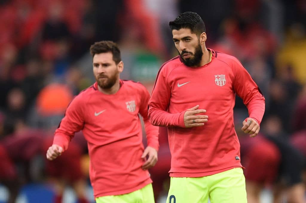 Barcelona's Argentinian striker Lionel Messi (L) and Barcelona's Uruguayan striker Luis Suarez warm up before the UEFA Champions league semi-final second leg football match between Liverpool and Barcelona at Anfield in Liverpool, north west England on May 7, 2019. (Photo by Oli SCARFF / AFP) (Photo credit should read OLI SCARFF/AFP/Getty Images)