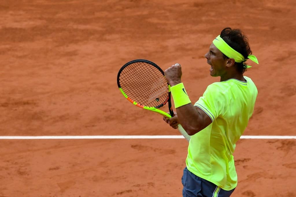 TOPSHOT - Spain's Rafael Nadal reacts after winning a point against Switzerland's Roger Federer during their men's singles semi-final match on day 13 of The Roland Garros 2019 French Open tennis tournament in Paris on June 7, 2019. (Photo by Philippe LOPEZ / AFP) (Photo credit should read PHILIPPE LOPEZ/AFP/Getty Images)