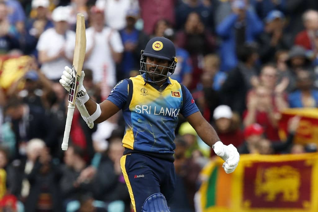 Sri Lanka's Kusal Perera celebrates his half century during the 2019 Cricket World Cup group stage match between Sri Lanka and Australia at The Oval in London on June 15, 2019. (Photo by Ian KINGTON / AFP) / RESTRICTED TO EDITORIAL USE (Photo credit should read IAN KINGTON/AFP/Getty Images)