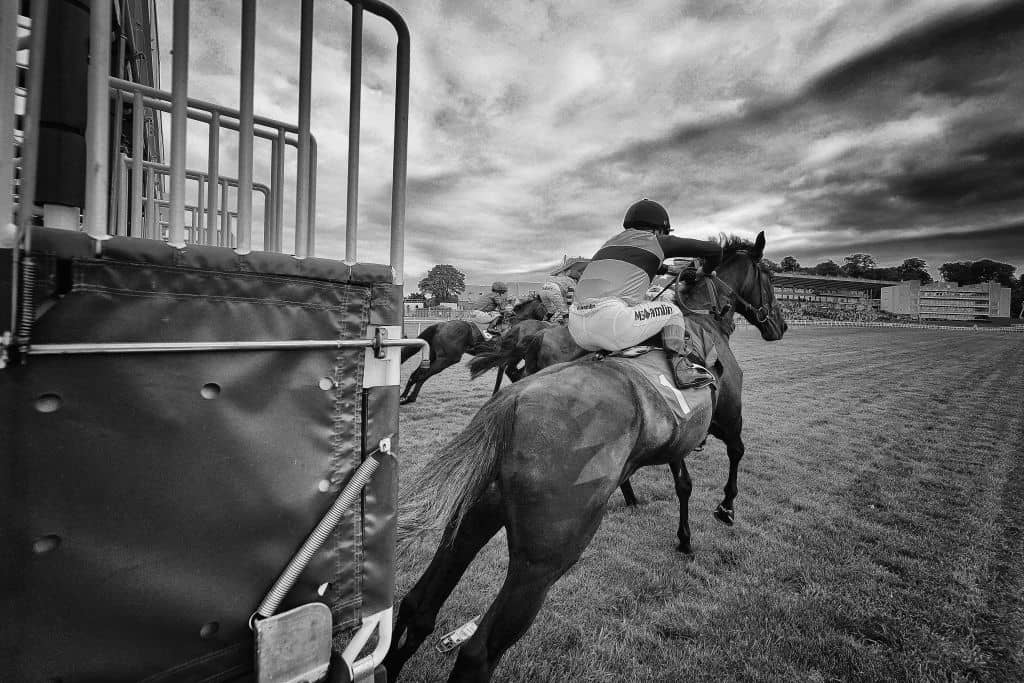 ESHER, ENGLAND - MAY 30: (EDITORS NOTE: This image was processed using digital filters) A general view as runners leave the starting stalls at Sandown Park on May 30, 2019 in Esher, England. (Photo by Alan Crowhurst/Getty Images)