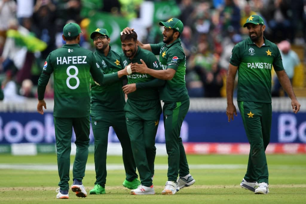 TAUNTON, ENGLAND - JUNE 12: Mohammad Amir of Pakistan celebrates taking the wicket of Mitchell Starc of Australia with his teammates during the Group Stage match of the ICC Cricket World Cup 2019 between Australia and Pakistan at The County Ground on June 12, 2019 in Taunton, England. (Photo by Alex Davidson/Getty Images)