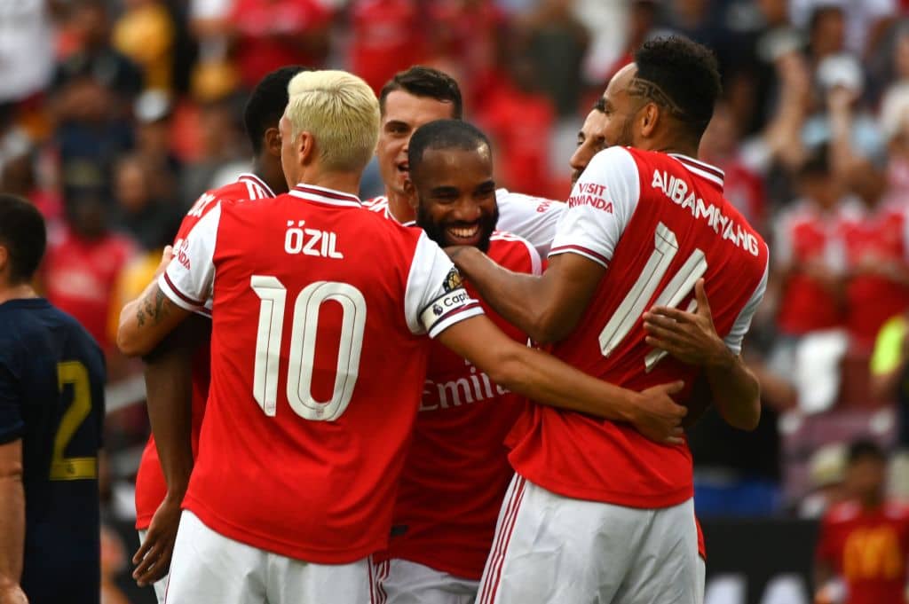 Arsenal's French striker Alexandre Lacazette (C) celebrates with teammates after scoring a goal during the International Champions Cup football match between Real Madrid and Arsenal at FedExField in Landover, Maryland, on July 23, 2019. (Photo by ANDREW CABALLERO-REYNOLDS / AFP) (Photo credit should read ANDREW CABALLERO-REYNOLDS/AFP/Getty Images)