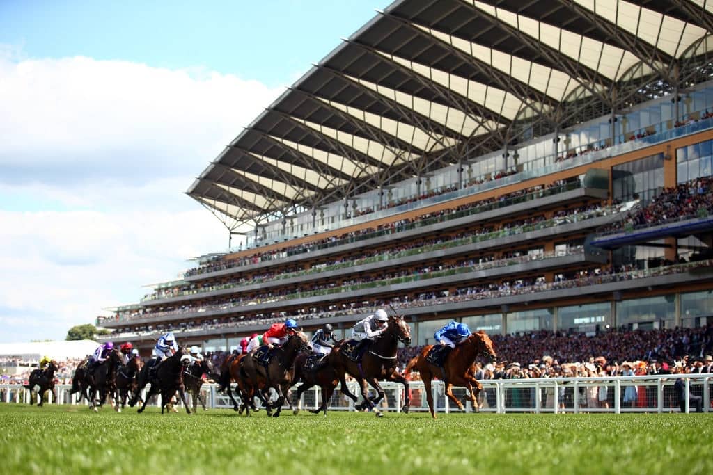 ASCOT, ENGLAND - JUNE 22: Daniel Tudhope (14) riding Space Traveller in leads the field on his way to winning The Jersey Stakes on day five of Royal Ascot at Ascot Racecourse on June 22, 2019 in Ascot, England. (Photo by Bryn Lennon/Getty Images for Ascot Racecourse)
