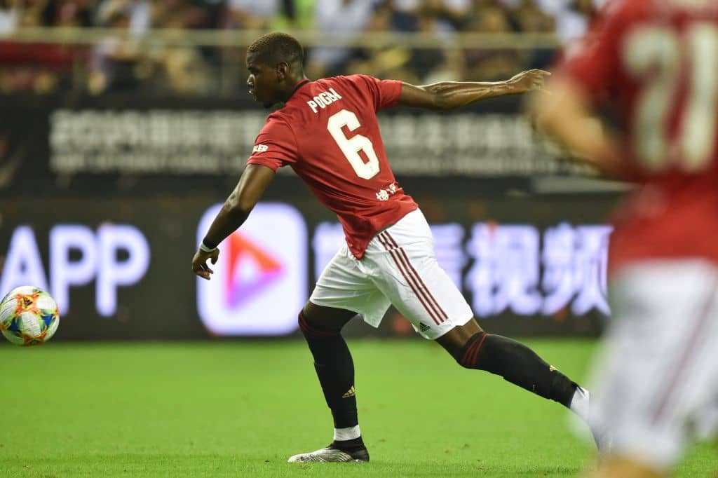 Manchester United's Paul Pogba with the ball during the International Champions Cup football tournament between English Premier League sides Manchester United and Tottenham at Hongkou Football Stadium in Shanghai on July 25, 2019. (Photo by HECTOR RETAMAL / AFP) (Photo credit should read HECTOR RETAMAL/AFP/Getty Images)