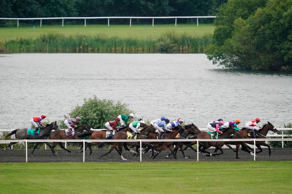 SUNBURY, ENGLAND - JUNE 26: A general view as runners race down the back straight at Kempton Park Racecourse on June 26, 2019 in Sunbury, England. (Photo by Alan Crowhurst/Getty Images)