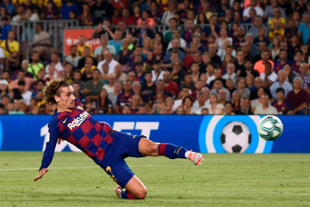 Barcelona's French forward Antoine Griezmann scores a goal during the Spanish League football match between Barcelona and Real Betis at the Camp Nou stadium in Barcelona on August 25, 2019. (Photo by Josep LAGO / AFP) (Photo credit should read JOSEP LAGO/AFP/Getty Images)