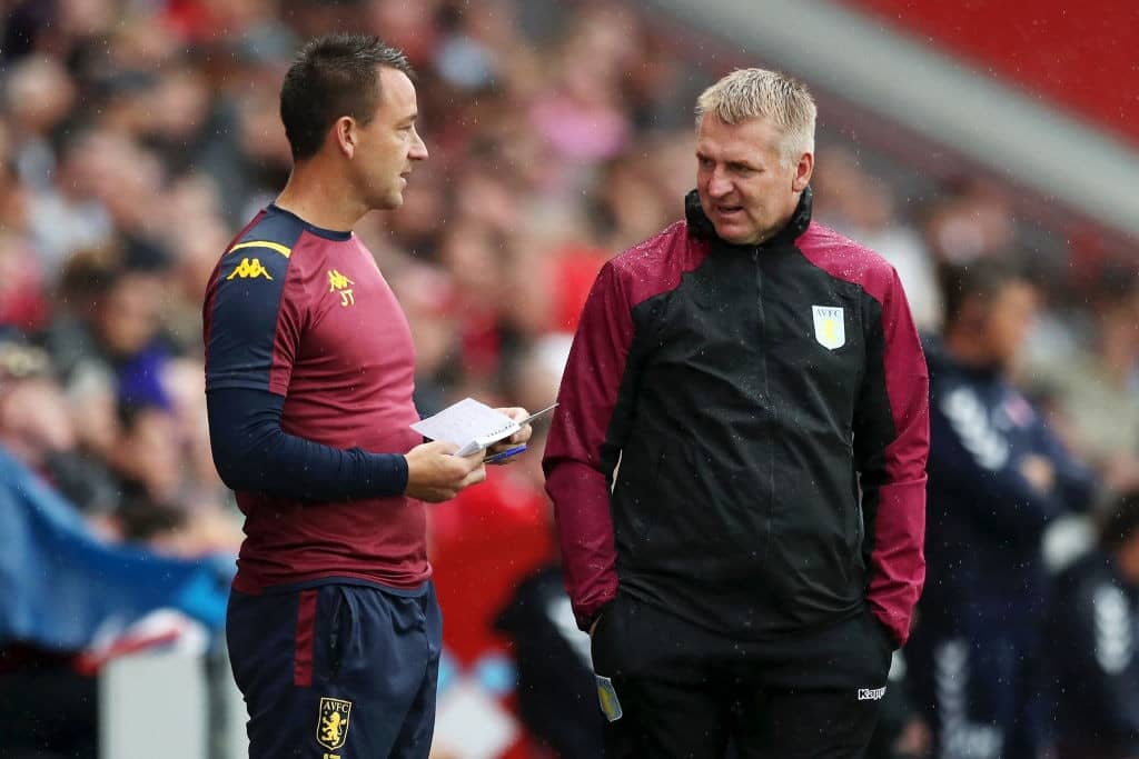 LONDON, ENGLAND - JULY 27: Assistant Head Coach, John Terry speaks with Manager of Aston Villa Dean Smith during the Pre-Season Friendly match between Charlton and Aston Villa at The Valley on July 27, 2019 in London, England. (Photo by Naomi Baker/Getty Images)