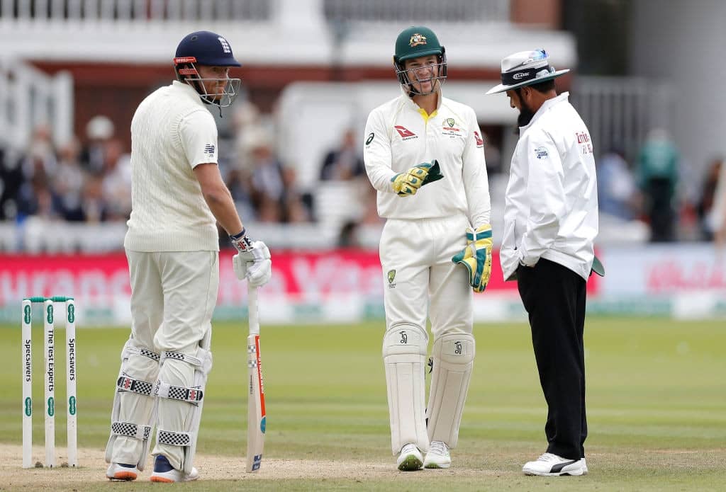 LONDON, ENGLAND - AUGUST 18: Tim Paine of Australia speaks to Umpire Aleem Dar after a Nathan Lyon of Australia lbw appeal was reviewed and dismissed during day five of the 2nd Specsavers Ashes Test between England and Australia at Lord's Cricket Ground on August 18, 2019 in London, England. (Photo by Ryan Pierse/Getty Images)