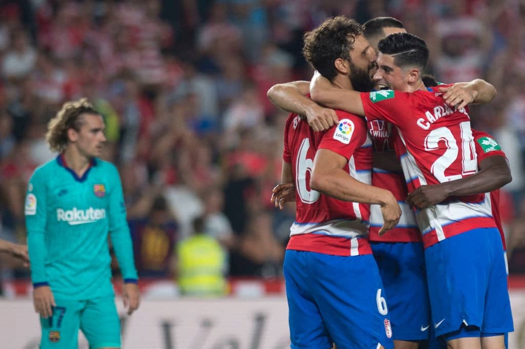 Granada's players celebrate their win at the end of the Spanish league football match between Granada FC and FC Barcelona at Nuevo Los Carmenes stadium in Granada on September 21, 2019. (Photo by JORGE GUERRERO / AFP) (Photo credit should read JORGE GUERRERO/AFP/Getty Images)