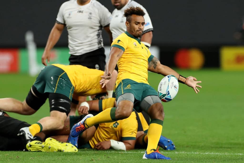 SAPPORO, JAPAN - SEPTEMBER 21: Will Genia of Australia kicks the ball during the Rugby World Cup 2019 Group D game between Australia and Fiji at Sapporo Dome on September 21, 2019 in Sapporo, Hokkaido, Japan. (Photo by David Rogers/Getty Images)