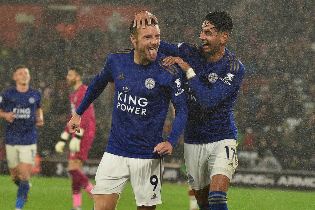 Leicester City's English striker Jamie Vardy celebrates scoring his team's fifth goal with Leicester City's Spanish striker Ayoze Perez during the English Premier League football match between Southampton and Leicester City at St Mary's Stadium in Southampton, southern England on October 25, 2019. (Photo by Glyn KIRK / AFP) / RESTRICTED TO EDITORIAL USE. No use with unauthorized audio, video, data, fixture lists, club/league logos or 'live' services. Online in-match use limited to 120 images. An additional 40 images may be used in extra time. No video emulation. Social media in-match use limited to 120 images. An additional 40 images may be used in extra time. No use in betting publications, games or single club/league/player publications. / (Photo by GLYN KIRK/AFP via Getty Images)