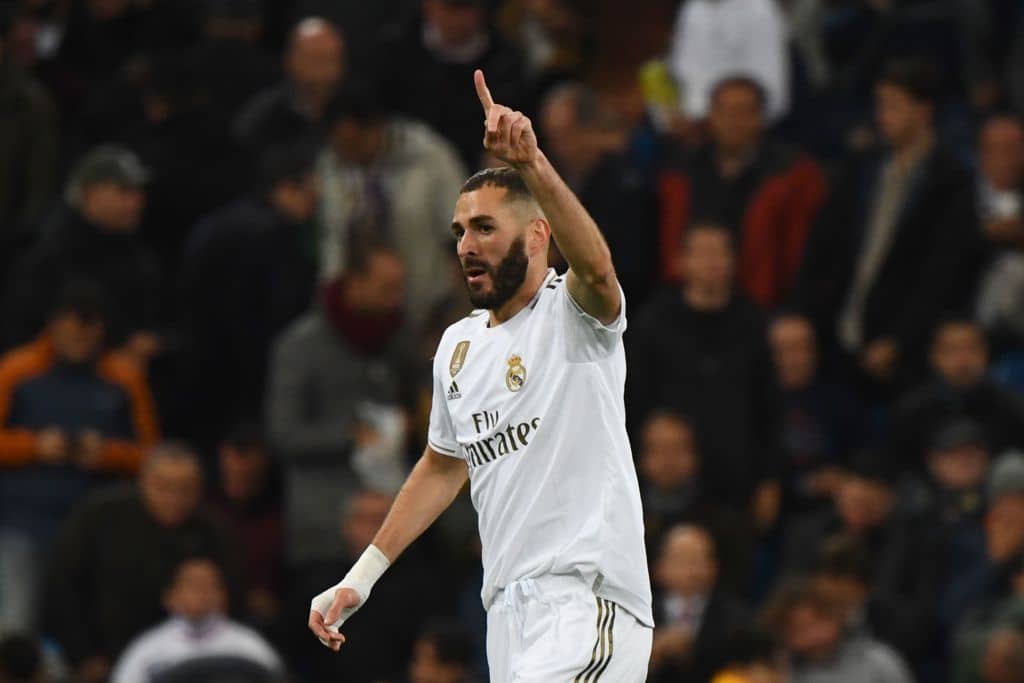 Real Madrid's French forward Karim Benzema celebrates after scoring during the UEFA Champions League Group A football match between Real Madrid and Galatasaray at the Santiago Bernabeu stadium in Madrid, on November 6, 2019. (Photo by GABRIEL BOUYS / AFP) (Photo by GABRIEL BOUYS/AFP via Getty Images)