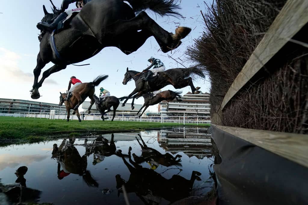 NEWBURY, ENGLAND - NOVEMBER 07: A general view as runners clear the water jump in The Micky Rawlings Memorial Handicap Chase at Newbury Racecourse on November 07, 2019 in Newbury, England. (Photo by Alan Crowhurst/Getty Images)