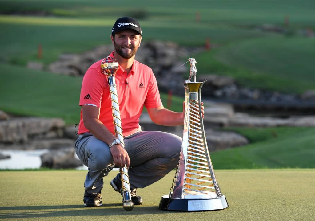 DUBAI, UNITED ARAB EMIRATES - NOVEMBER 24: Jon Rahm of Spain poses with the DP World Tour Championship trophy and the Race to Dubai trophy following his victory during Day Four of the DP World Tour Championship Dubai at Jumerirah Golf Estates on November 24, 2019 in Dubai, United Arab Emirates. (Photo by Ross Kinnaird/Getty Images)