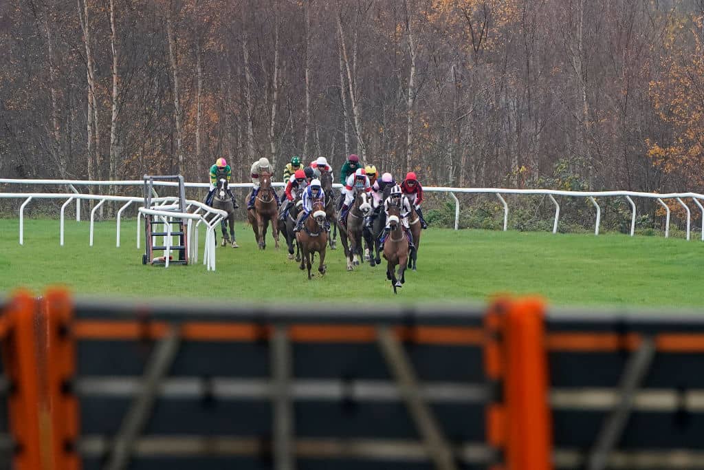 TAUNTON, ENGLAND - NOVEMBER 28: Harry Cobden riding Eritage leads into the straight on their way to winning The Annual Membership 2020 Available Today 'National Hunt' Novices' Hurdle (Div 1) at Taunton Racecourse on November 28, 2019 in Taunton, England. (Photo by Alan Crowhurst/Getty Images)