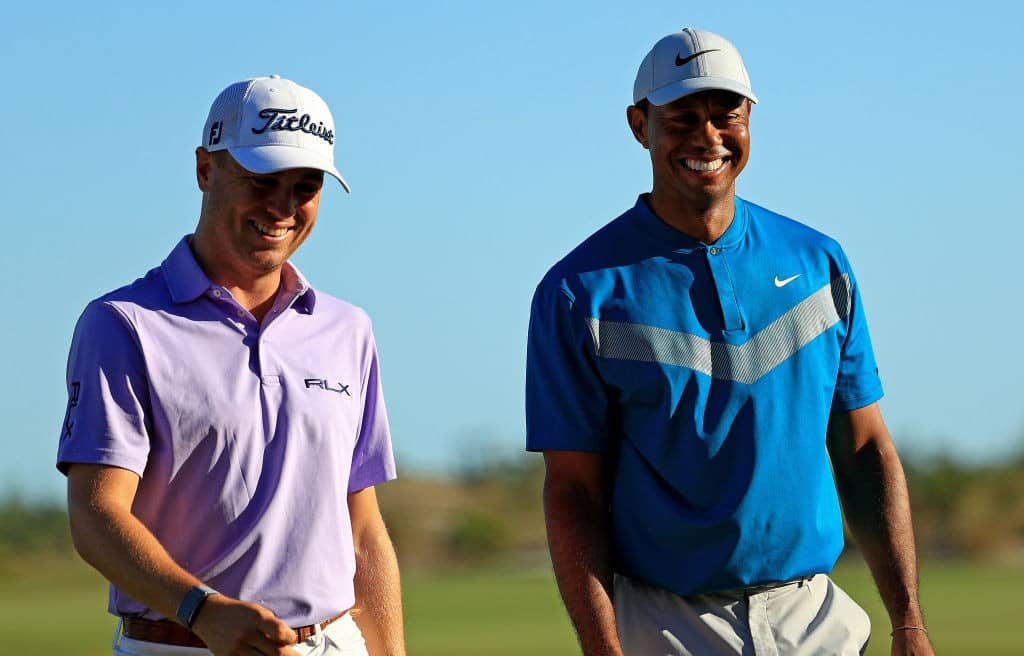 NASSAU, BAHAMAS - DECEMBER 06: Tiger Woods and Justin Thomas of the United States walk off the 18th hole during the third round of the Hero World Challenge on December 06, 2019 in Nassau, Bahamas. (Photo by Mike Ehrmann/Getty Images)