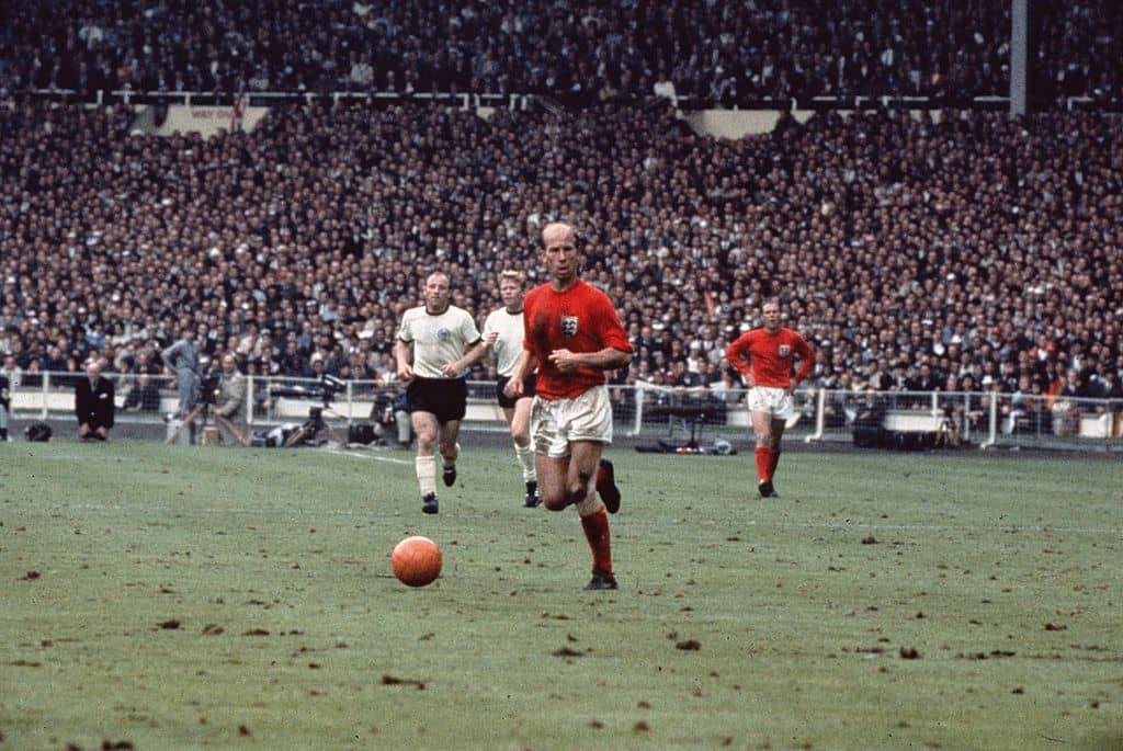 30th July 1966: Bobby Charlton with the ball during the 1966 World Cup Final against West Germany at Wembley Stadium. England won 4-2. (Photo by Fox Photos/Getty Images)