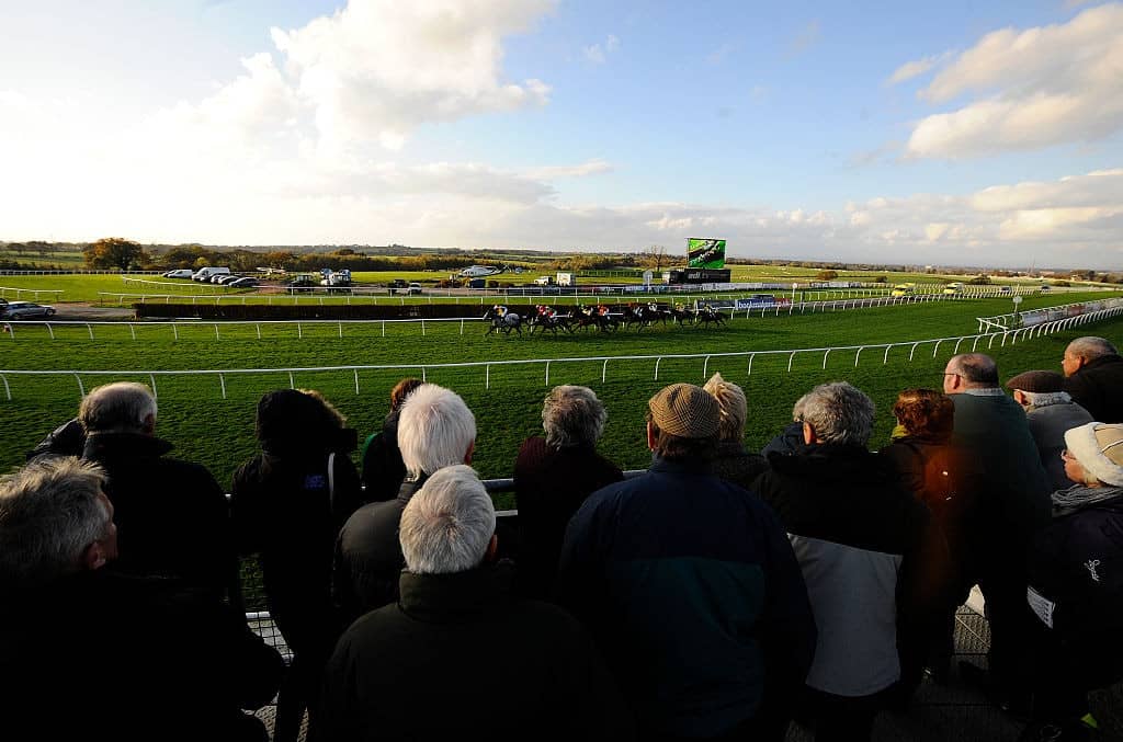 CARLISLE, ENGLAND - NOVEMBER 02: A general view as racegoers look on as the runners pass at Carlisle racecourse on November 02, 2014 in Carlisle, England. (Photo by Alan Crowhurst/Getty Images)