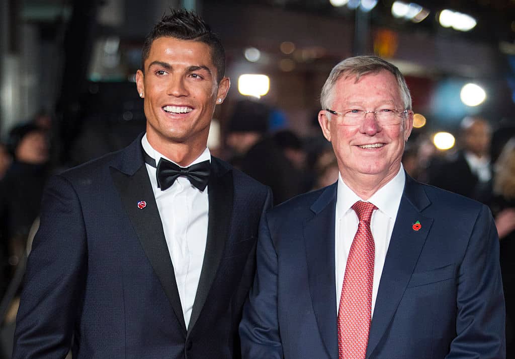 Real Madrid's Portuguese forward Cristiano Ronaldo (L) poses with former Manchester United manager Sir Alex Ferguson at the world premiere of the film Ronaldo in central London on November 9, 2015. AFP PHOTO / JACK TAYLOR / AFP / JACK TAYLOR (Photo credit should read JACK TAYLOR/AFP/Getty Images)