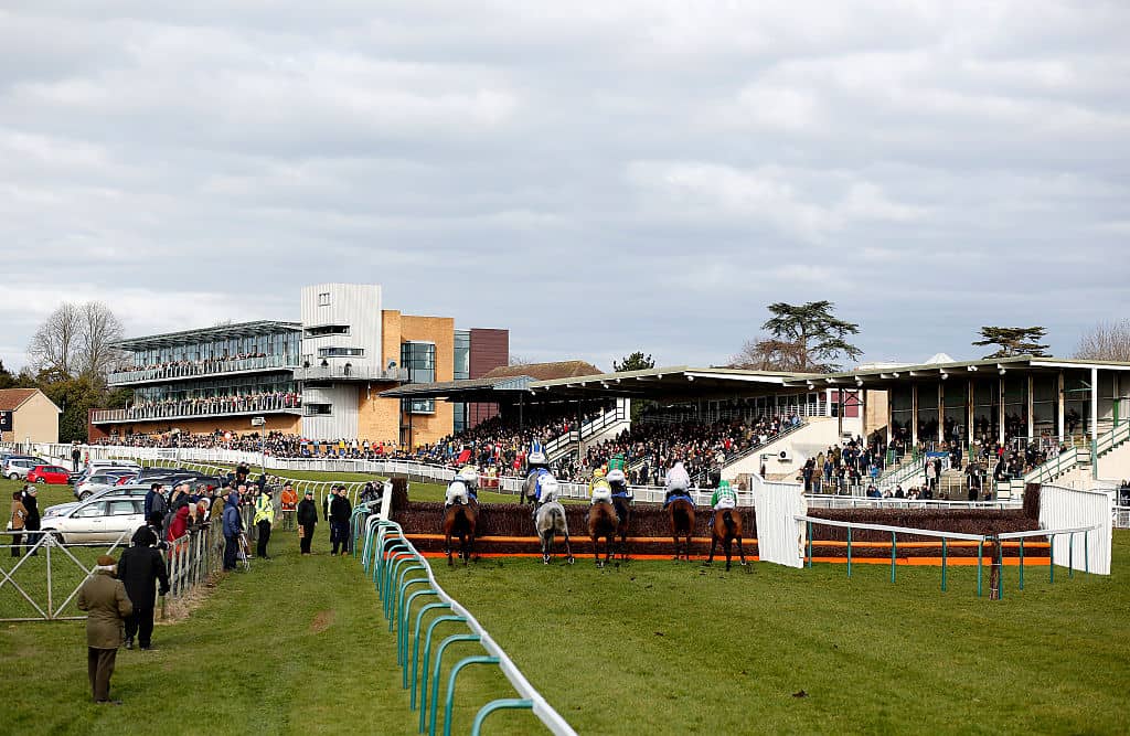FONTWELL, ENGLAND - FEBRUARY 28: A general view as runners clear the fence in front of the grandstands at Fontwell racecourse on February 28, 2016 in Fontwell, England. (Photo by Alan Crowhurst/Getty Images)