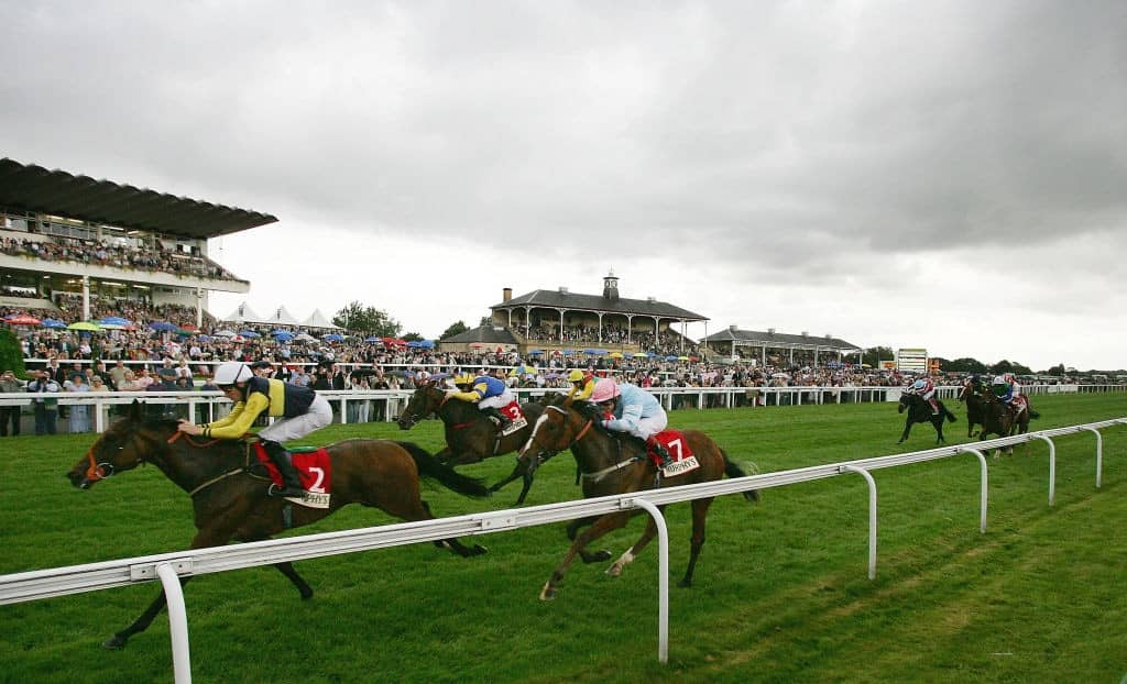 DONCASTER, ENGLAND - SEPTEMBER 8: Nasheej (No2) rides to victory in the Murphy's Fastflow May Hill Stakes during The Ladbrokes St Leger Festival at Doncaster Race Course on September 8, 2005 in Doncaster, England. (Photo by Laurence Griffiths/Getty Images)
