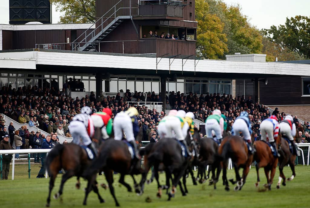HUNTINGDON, ENGLAND - NOVEMBER 08: Stewards and officials watch on from their high vantage point as runners pass the grandstands at Huntingdon racecourse on November 8, 2016 in Huntingdon, England. (Photo by Alan Crowhurst/Getty Images)