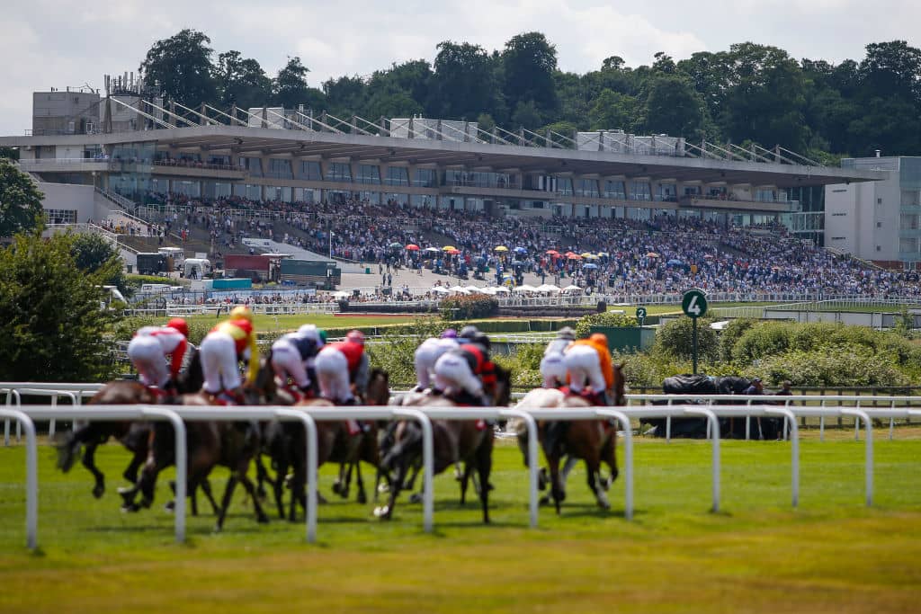 ESHER, ENGLAND - JUNE 17: A general view as runners race up the straight five furlong course at Sandown racecourse on June 17, 2017 in Esher, England. (Photo by Alan Crowhurst/Getty Images)