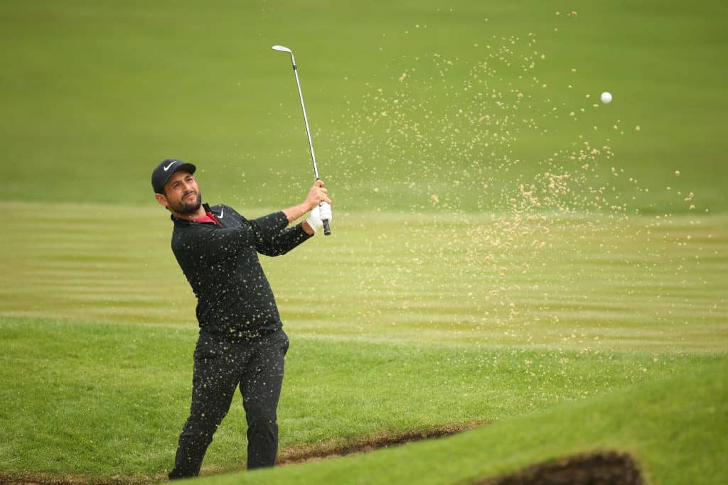 VIRGINIA WATER, ENGLAND - MAY 24: Alexander Levy of France plays out of the bunker onto the 12th green during day one of the 2018 BMW PGA Championship at Wentworth on May 24, 2018 in Virginia Water, England. (Photo by Alex Pantling/Getty Images)