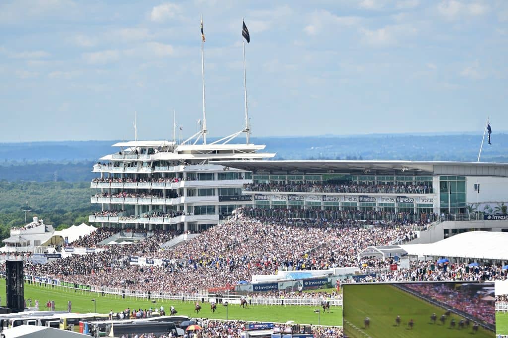 Viewed from the top of the course runners and riders in the first race enter the final furlong on the second day of the Epsom Derby Festival in Surrey, southern England on June 2, 2018. (Photo by Glyn KIRK / AFP) (Photo credit should read GLYN KIRK/AFP/Getty Images)